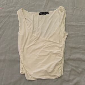 White nasty gal wrap top. Small stain. Can be bleached out in the sun easily